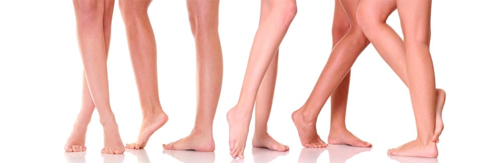 Three women 's legs and feet are shown in a row.